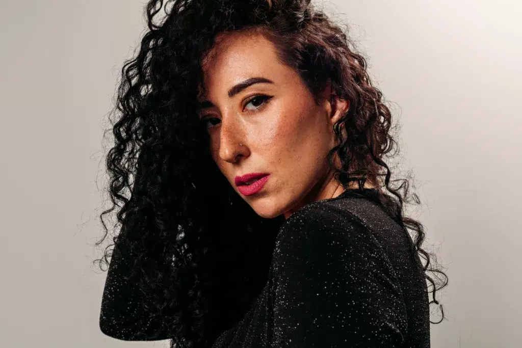 A person has curly hair.