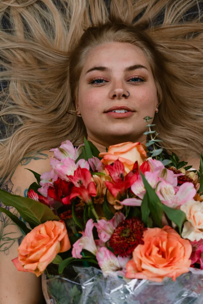 A person holds a bouquet of flowers.