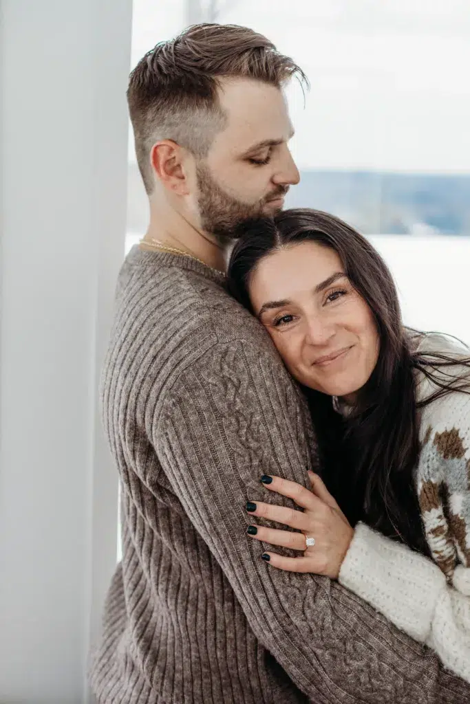 Engagement Photo Showcasing A Happy Couple In A Room