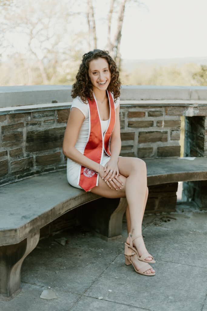 A person sits on a bench.