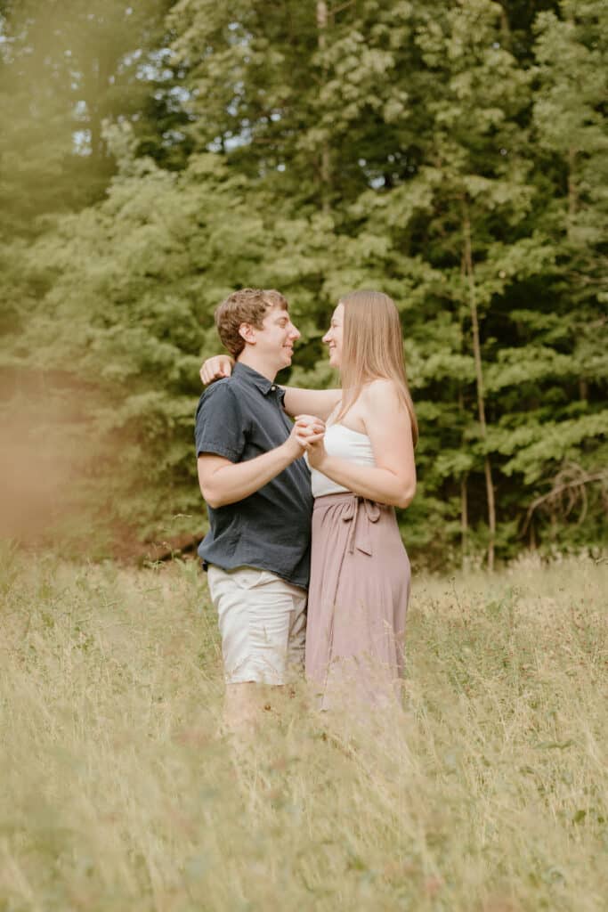 Couple Posing In A Field Of Tall Grass