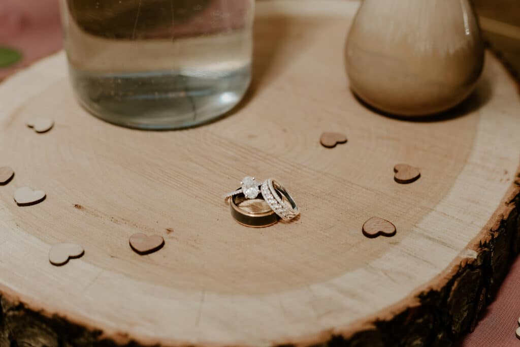 A wooden table sits indoors, inviting guests to gather around.