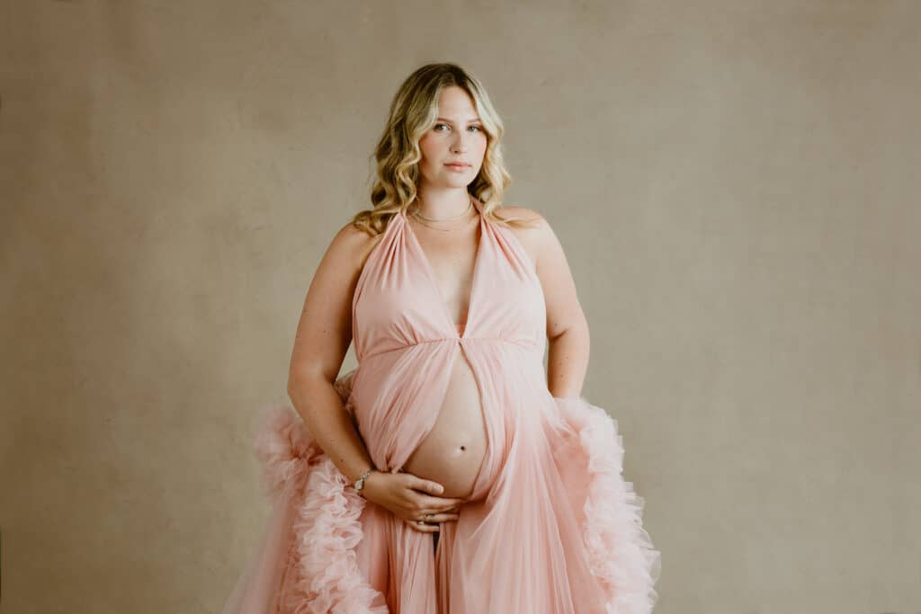 A person wears a pink dress.