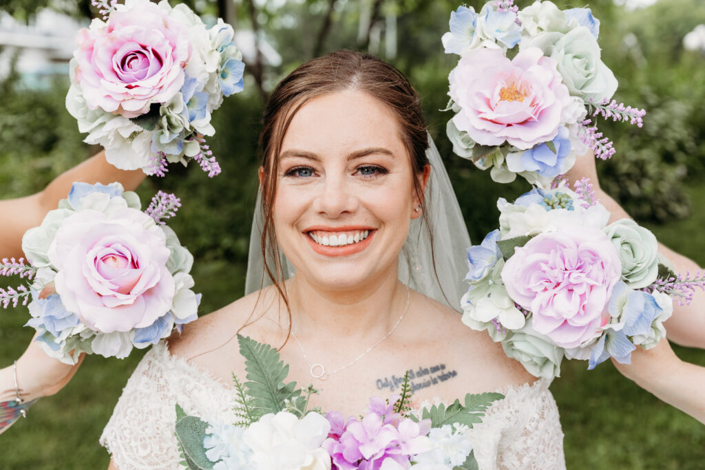 A woman surrounded by bouquets