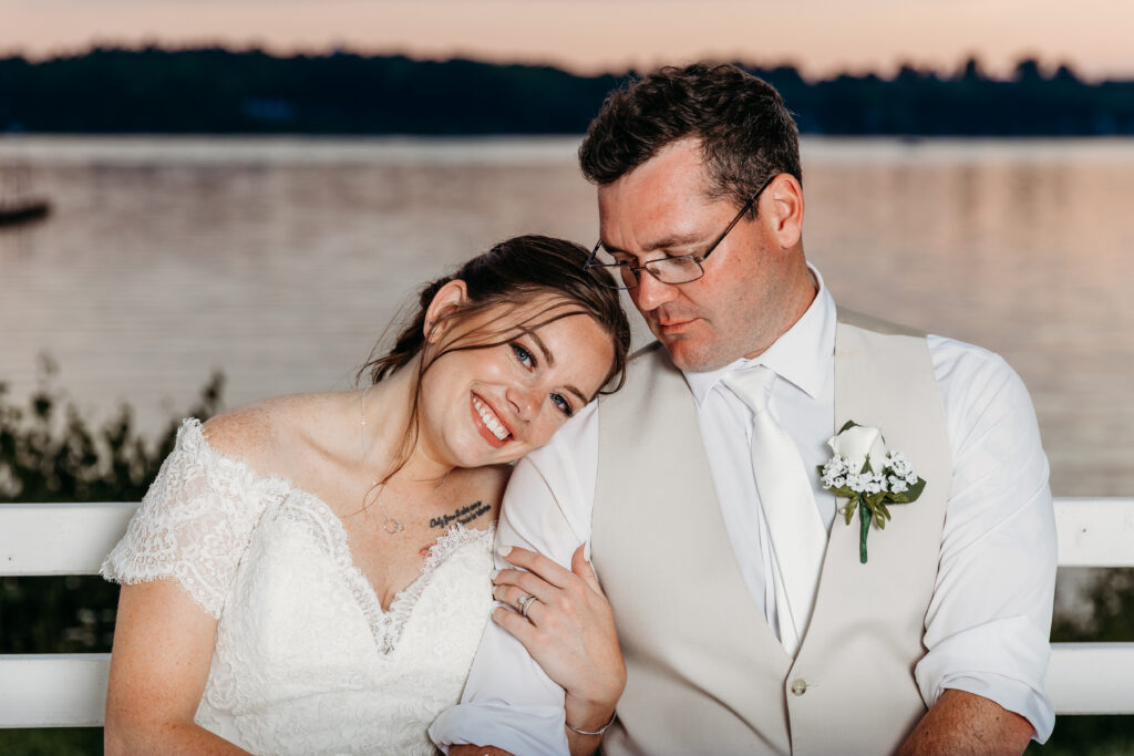 A woman leaning to her husband.