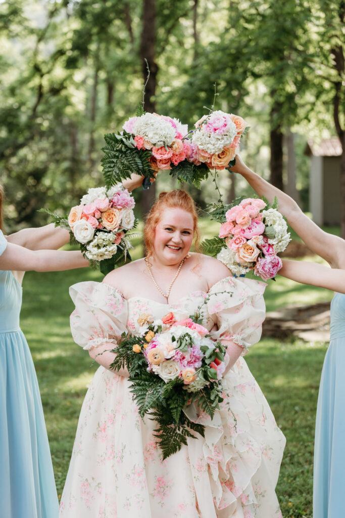 A bride surrounded by bouquets